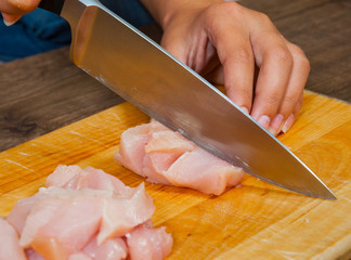 Chef cutting the meat on a board