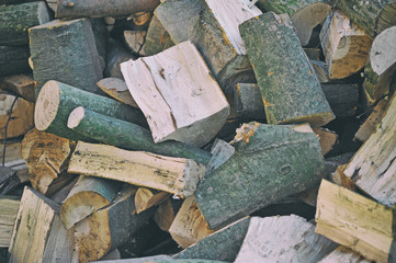 A bunch of firewood. Beech firewood. Natural wooden background - closeup of chopped firewood.