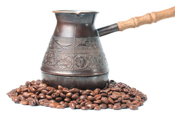 Coffee pot with coffee beans on a white background