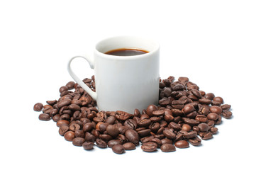 Coffee mug with coffee and coffee beans on a white background