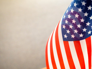 Obraz premium American flag on the table, part overexposed and blurry, the independence of America, the great power USA