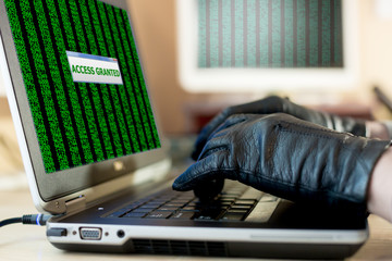 Close up View of Hands of Hacker working on Laptop