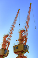 Cargo cranes on the dock of the port
