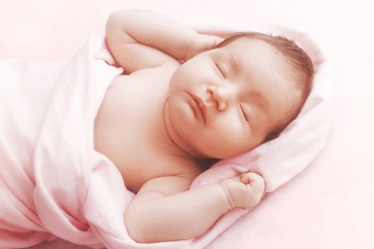 Newborn Baby Girl Sleep On Pink Blanket