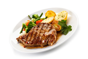 Grilled beefsteak with broccoli and carrot on white background