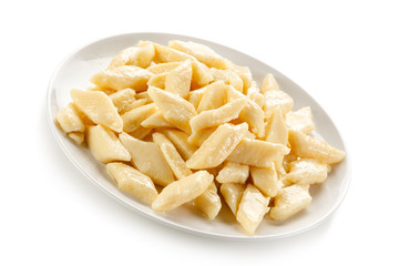 Potato noodles - dumplings on white background