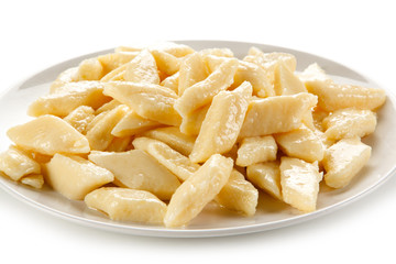 Potato noodles - dumplings on white background