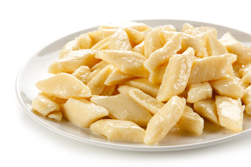 Potato noodles - dumplings on white background