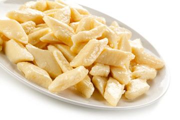 Potato noodles - dumplings on white background