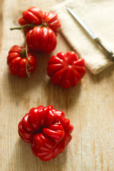 Tomatoes on a wooden background. Selectiv focus.