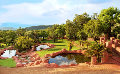 African landscape of a lodge with a nice garden and lakes. Everything for your relaxation in a...