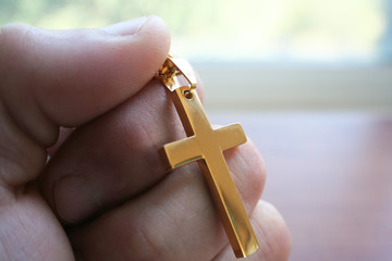 Golden Catholic Cross In Hand 