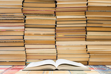 A stack of books with colorful covers. The library or bookstore. Books or textbooks. Education and...