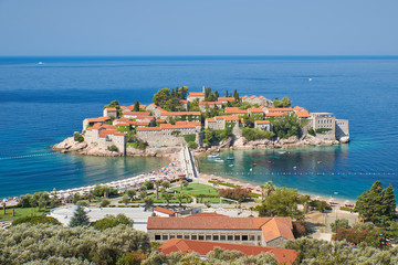 Sveti Stefan is a small island and luxury resort on the Adriatic coast of Montenegro, is located 6 kilometres south of Budva - obrazy, fototapety, plakaty