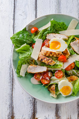 Grilled chicken salad with tamatoes and parmesan cheese