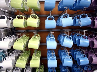 Colorful ceramic mugs on display