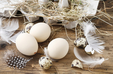 Simple easter decoration with egg and hay wreath.