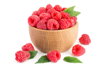 Raspberry in a wooden bowl isolated on a white background