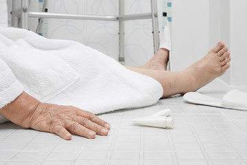 Elderly woman falling in bathroom because slippery surfaces