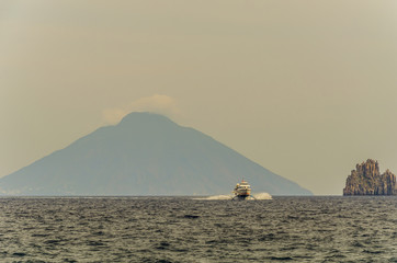 Fototapeta na wymiar Sea tyrrhenian ferry rock and volcano stromboli