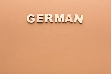 Word German on beige background