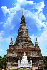 Fototapeta premium Beautiful pagoda and white buddha with sunny blue sky at Ayutthaya in Thailand