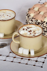 coffee with whipped cream and chocolate and coffee with cream cake