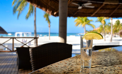 Obraz premium Tequila shot on the beach bar