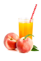 Glass of fruit juice with straw and peaches isolated on white background