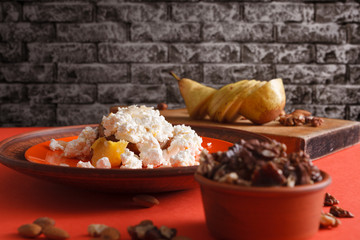 Healthy breakfast - cottage cheese, nuts and fruit