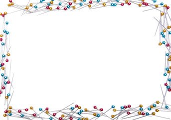 Border of red and blue and yellow push pin on white background.