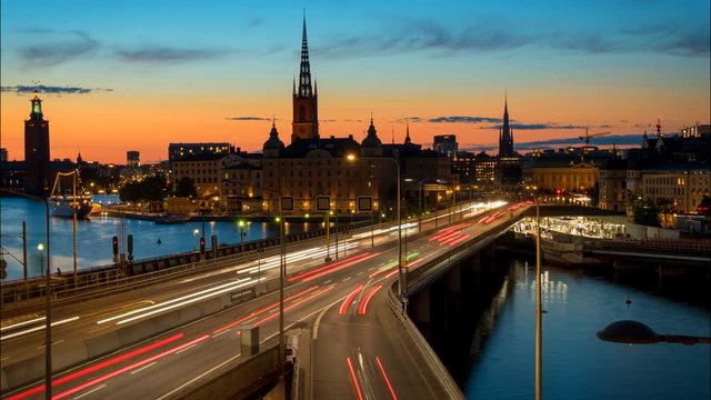 Stockholm, Sweden. Time lapse of Stockholm city center during sunset. Centralbron bridge with traffic