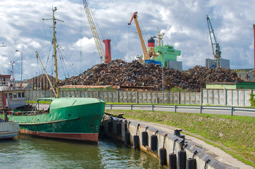 Scrap metal being sorted for recycling. The pile of metals will be loaded onto a ship for export