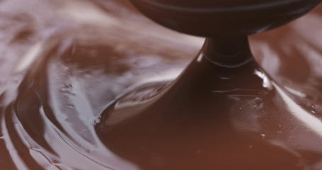 pouring melted premium dark chocolate