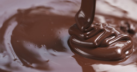 pouring melted premium dark chocolate