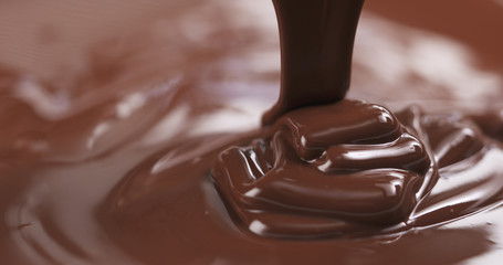 pouring melted premium dark chocolate