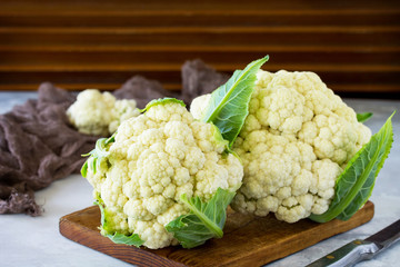 Young cauliflower on gray stone or slate background. With copy space. The concept of a healthy diet.