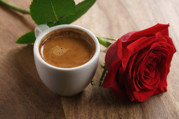 fresh espresso with red rose flower