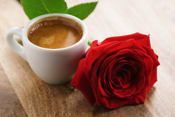 fresh espresso with red rose flower