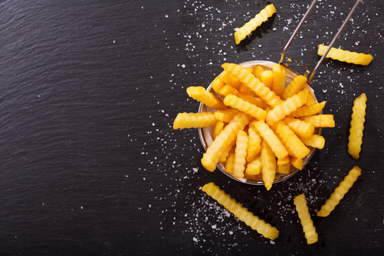 French fries on dark background