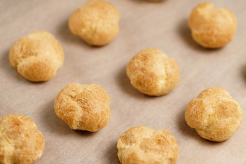 profiteroles on brown paper closeup