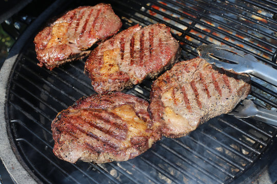 Closeup of a beef steak on the grill