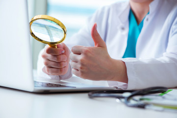 Doctor hand with magnifying glass