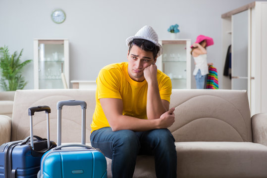 Young Family Preparing For Travel Vacation