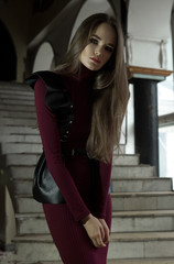 Beautiful girl, a model in a refined outfit in a creative location. Fashion, style, beauty, portrait.