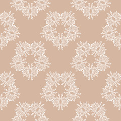 Seamless pattern with brown and white ornaments