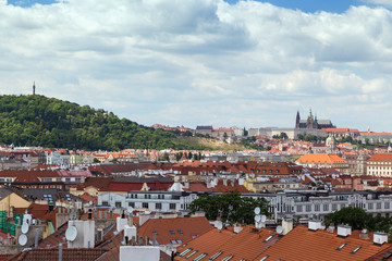 Obraz premium Petrin Hill, Prague (Hradcany) Castle and old buildings in Prague, Czech Republic, viewed from the Vysehrad fort.