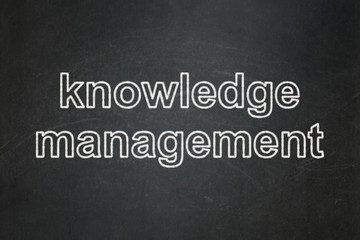 Education concept: Knowledge Management on chalkboard background