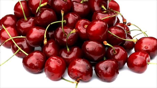 red juicy cherries rotating, fresh ripe fruit
