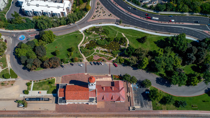 Aerial view of a local train depot and sity park in summer